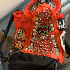Hardware orange back pack fully studded and spiked with loads of patches
